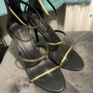 bebe Black Stiletto Sandals with Gold Accent Straps